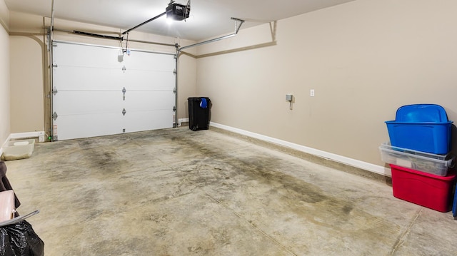 51 Stearns Farm Rd, Hampden, ME 04444 - garage with a garage door opener and baseboards