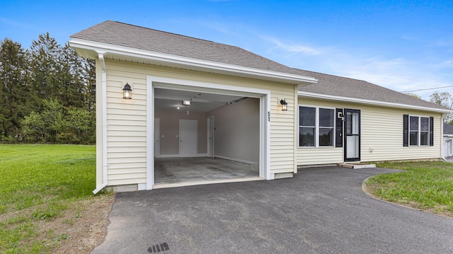 51 Stearns Farm Rd, Hampden, ME 04444 - view of front of property with driveway, a front yard, roof with shingles, and an attached garage