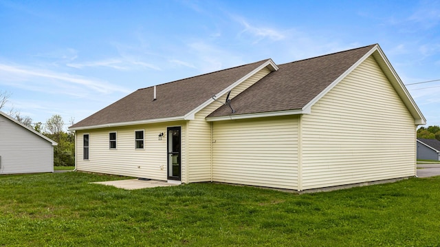 51 Stearns Farm Rd, Hampden, ME 04444 - back of house featuring roof with shingles and a lawn