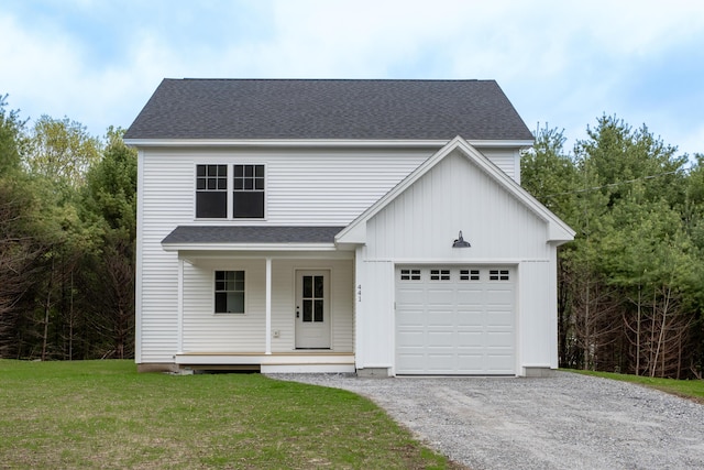 441 Harrison Rd, Naples, ME 04055 - view of front of home featuring covered porch, a front lawn, gravel driveway, a shingled roof, and an attached garage