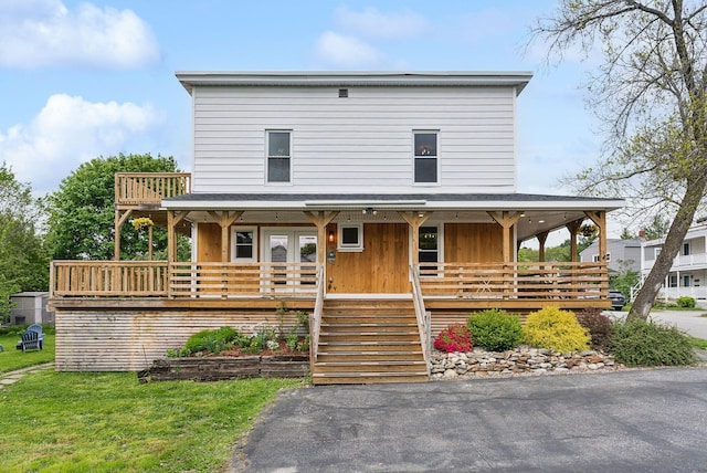 124 Dumont Ave, Lewiston, ME 04240 - view of front facade with a porch, french doors, and stairway
