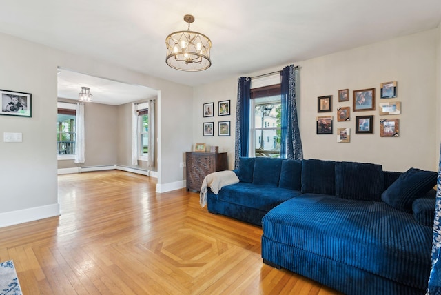124 Dumont Ave, Lewiston, ME 04240 - living room featuring a chandelier, baseboards, and baseboard heating