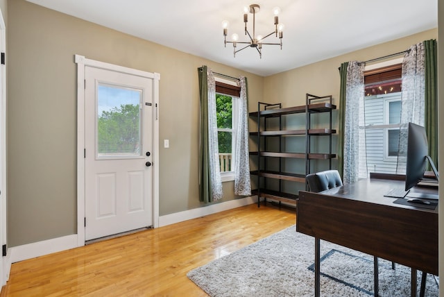 124 Dumont Ave, Lewiston, ME 04240 - office with a chandelier, wood finished floors, and baseboards