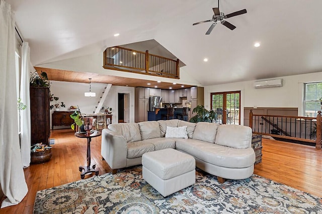 39 Lobo Ln, West Gardiner, ME 04345 - living area with a wall unit AC, hardwood / wood-style floors, a ceiling fan, high vaulted ceiling, and recessed lighting