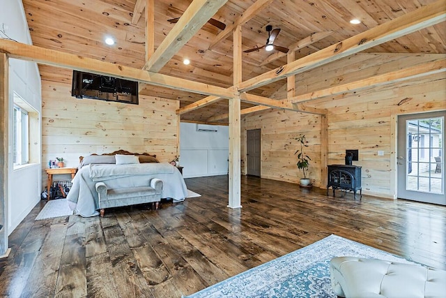 39 Lobo Ln, West Gardiner, ME 04345 - bedroom featuring wooden ceiling with exposed beams, wooden walls, wood-type flooring, a wood stove, and a wall mounted AC