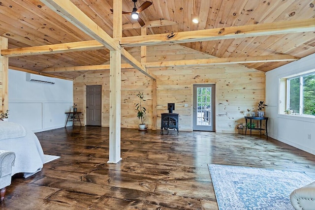 39 Lobo Ln, West Gardiner, ME 04345 - living room with wooden ceiling, wood finished floors, a wood stove, a wall mounted AC, and a ceiling fan