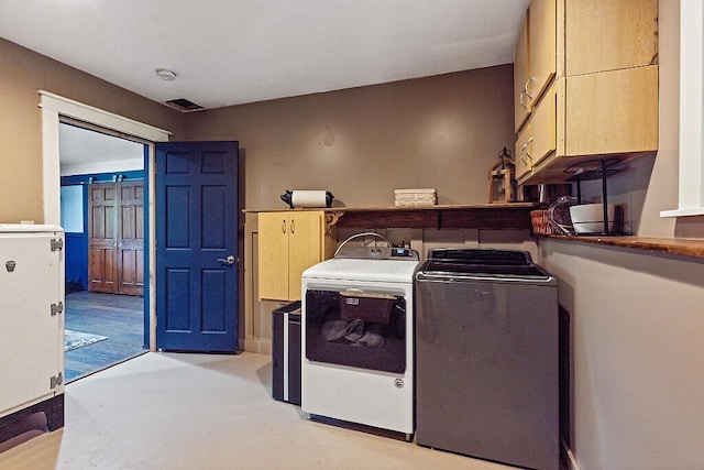 39 Lobo Ln, West Gardiner, ME 04345 - laundry room with cabinet space and separate washer and dryer