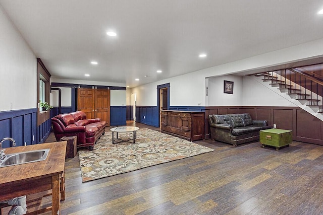 39 Lobo Ln, West Gardiner, ME 04345 - living room with wood finished floors, wainscoting, stairs, recessed lighting, and a decorative wall