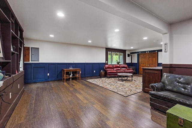 39 Lobo Ln, West Gardiner, ME 04345 - living area with dark wood-style floors, wainscoting, recessed lighting, electric panel, and a decorative wall
