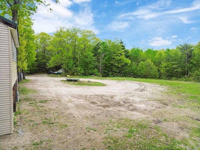 39 Lobo Ln, West Gardiner, ME 04345 - view of yard with a wooded view