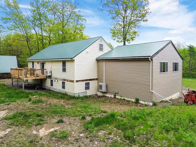 39 Lobo Ln, West Gardiner, ME 04345 - back of house with a deck, metal roof, and a cooling unit