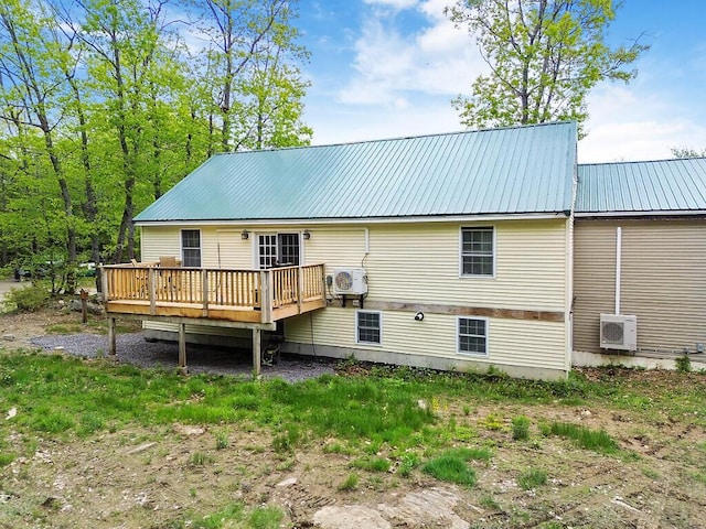 39 Lobo Ln, West Gardiner, ME 04345 - back of house with a deck, metal roof, and ac unit