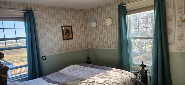 110 Bog Rd, Limestone, ME 04750 - bedroom featuring multiple windows and wallpapered walls