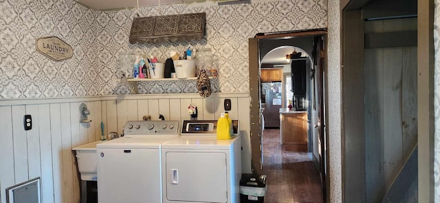 110 Bog Rd, Limestone, ME 04750 - washroom featuring independent washer and dryer, wallpapered walls, wainscoting, wood finished floors, and arched walkways