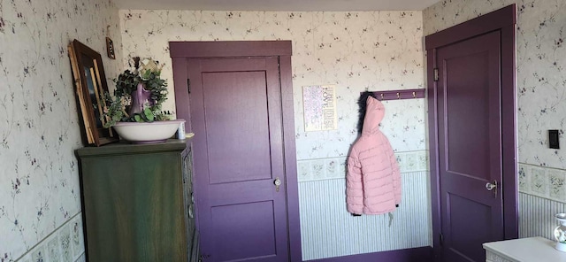 110 Bog Rd, Limestone, ME 04750 - doorway to outside featuring wallpapered walls