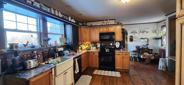 110 Bog Rd, Limestone, ME 04750 - kitchen featuring black appliances, arched walkways, backsplash, dark wood finished floors, and ornamental molding