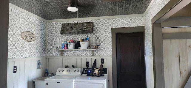 110 Bog Rd, Limestone, ME 04750 - washroom featuring washing machine and clothes dryer, wallpapered walls, and a wainscoted wall