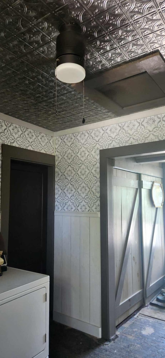 110 Bog Rd, Limestone, ME 04750 - detailed view of a wainscoted wall, washer / dryer, and wallpapered walls