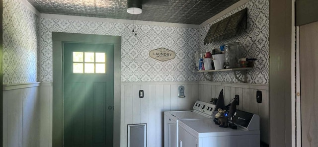 110 Bog Rd, Limestone, ME 04750 - laundry area featuring independent washer and dryer, wallpapered walls, and a wainscoted wall