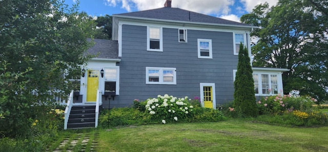 110 Bog Rd, Limestone, ME 04750 - rear view of property featuring a yard, roof with shingles, and a chimney
