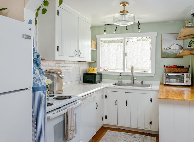 313 Sam Allen Rd, Sanford, ME 04073 - kitchen with white appliances, a sink, light countertops, decorative backsplash, and white cabinets