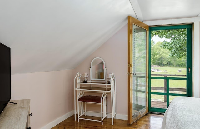313 Sam Allen Rd, Sanford, ME 04073 - bedroom featuring vaulted ceiling, wood finished floors, baseboards, and access to exterior