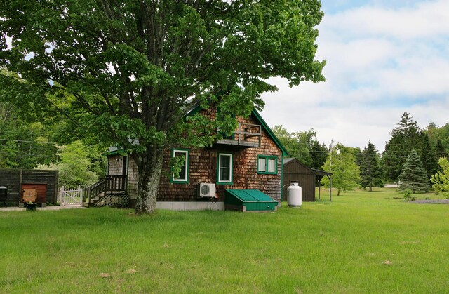 313 Sam Allen Rd, Sanford, ME 04073 - rear view of property featuring a cooling unit and a lawn