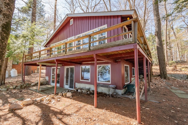 54 Papoose Island Rd, Raymond, ME 04071 - back of property featuring a wooden deck and board and batten siding