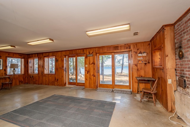 54 Papoose Island Rd, Raymond, ME 04071 - entrance foyer with concrete floors, wooden walls, and a water view
