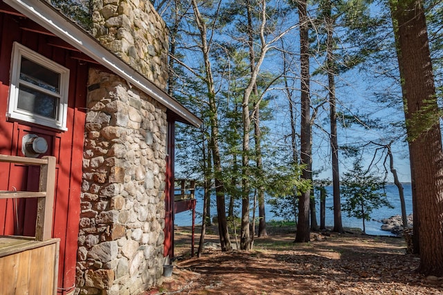 54 Papoose Island Rd, Raymond, ME 04071 - view of home's exterior featuring stone siding and a chimney