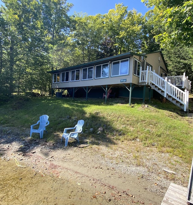 476 Springy Pond Rd, Otis, ME 04605 - rear view of house featuring a sunroom and a deck