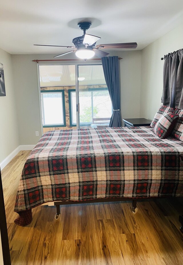 476 Springy Pond Rd, Otis, ME 04605 - bedroom with wood finished floors, ceiling fan, and baseboards