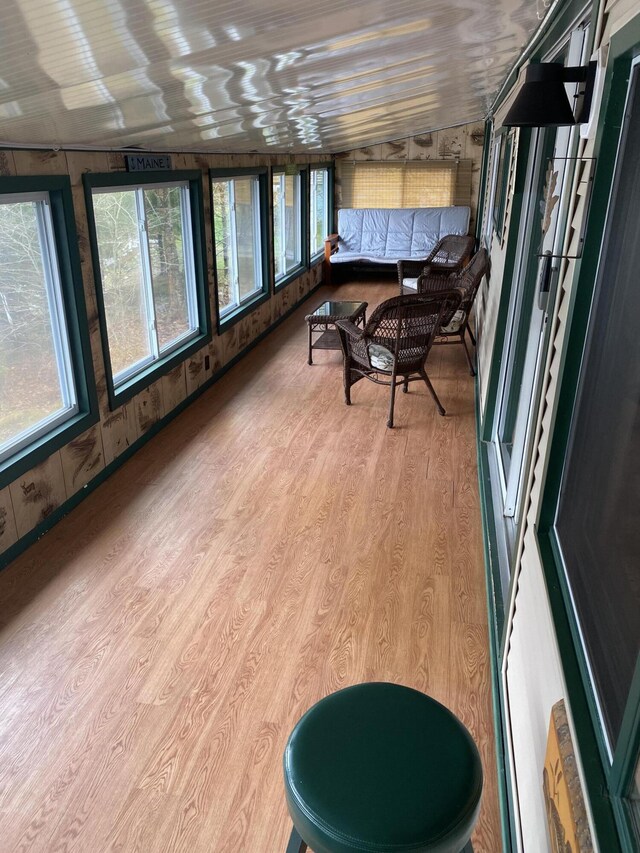 476 Springy Pond Rd, Otis, ME 04605 - sunroom featuring outdoor lounge area, wood finished floors, and wooden walls