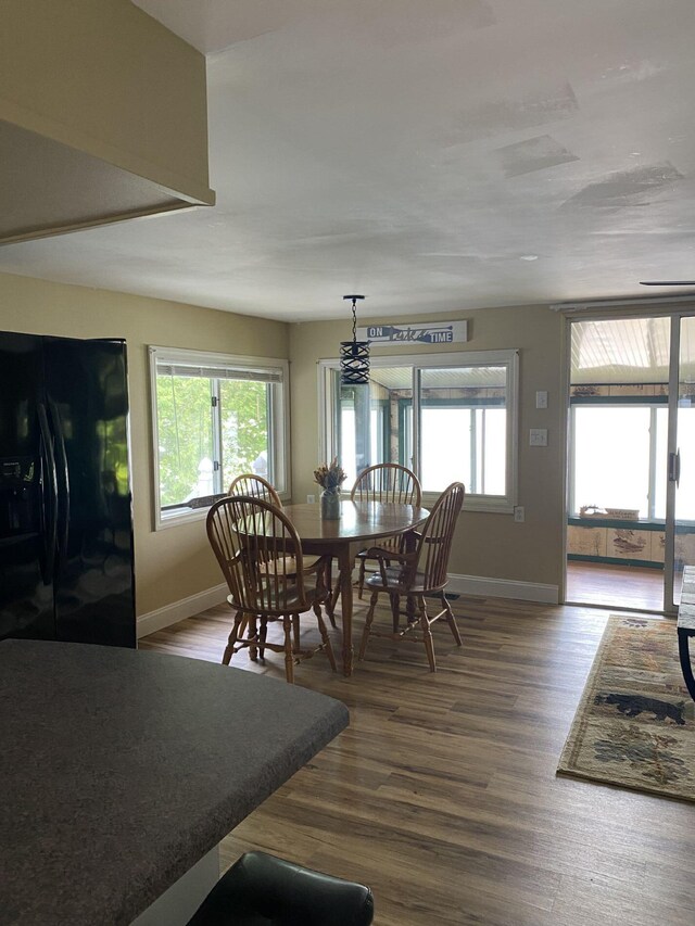 476 Springy Pond Rd, Otis, ME 04605 - dining area featuring plenty of natural light and wood finished floors
