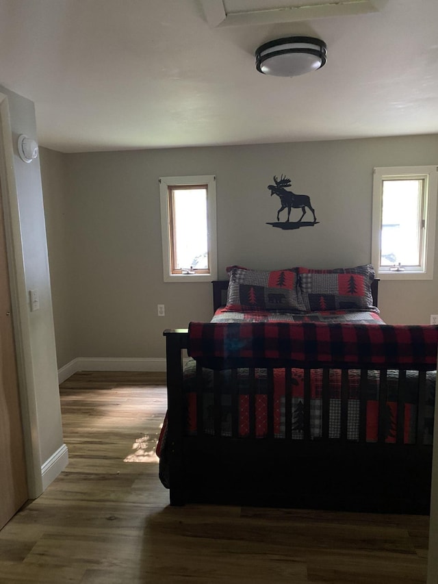 476 Springy Pond Rd, Otis, ME 04605 - bedroom with multiple windows and wood finished floors