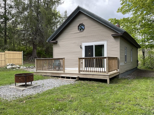 3 Brook St, Lisbon, ME 04250 - back of property featuring a fire pit, a deck, and a chimney