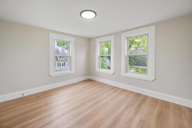 50 14th St, Bangor, ME 04401 - unfurnished room with light wood-style floors, healthy amount of natural light, and baseboards