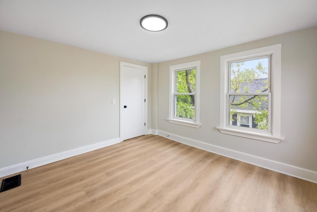 50 14th St, Bangor, ME 04401 - empty room featuring baseboards and light wood finished floors