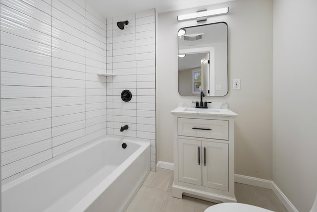 50 14th St, Bangor, ME 04401 - bathroom with bathtub / shower combination, vanity, baseboards, toilet, and tile patterned flooring