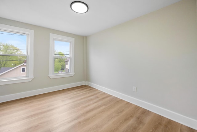 50 14th St, Bangor, ME 04401 - spare room with light wood-type flooring and baseboards