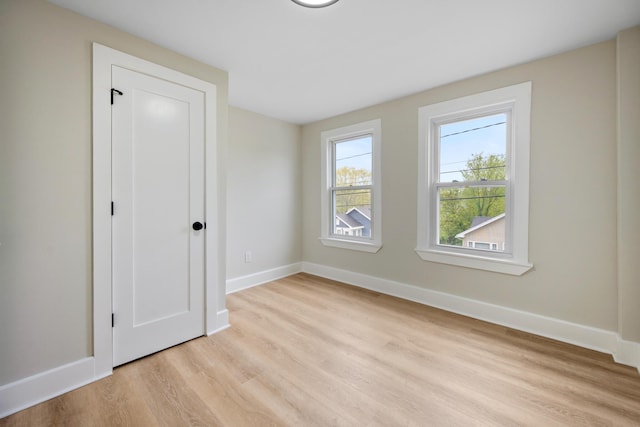 50 14th St, Bangor, ME 04401 - unfurnished bedroom featuring light wood finished floors and baseboards