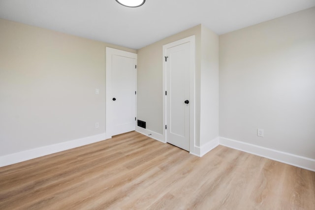 50 14th St, Bangor, ME 04401 - empty room with light wood-type flooring and baseboards