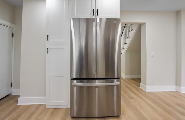 50 14th St, Bangor, ME 04401 - kitchen with freestanding refrigerator, light wood-style flooring, and baseboards