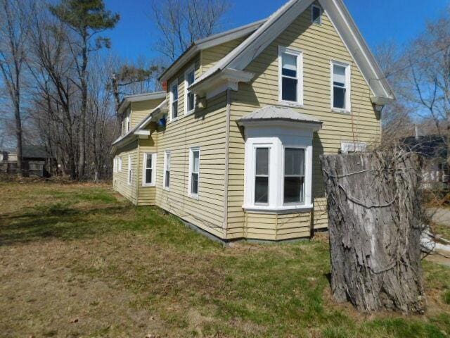 10 Summer St, Calais, ME 04619 - view of property exterior with a yard