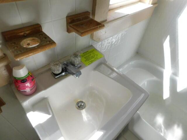 10 Summer St, Calais, ME 04619 - full bath with tile walls