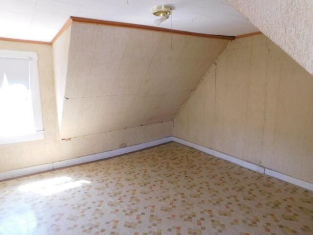 10 Summer St, Calais, ME 04619 - bonus room featuring baseboards and lofted ceiling
