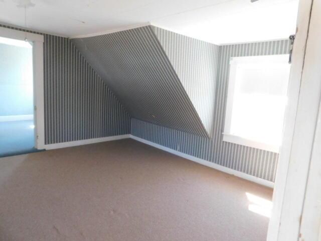 10 Summer St, Calais, ME 04619 - bonus room featuring carpet and lofted ceiling