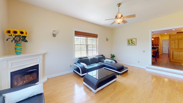 335 Western Ave, Hampden, ME 04444 - living area featuring light wood-style floors, a ceiling fan, baseboards, a glass covered fireplace, and recessed lighting