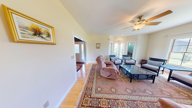 335 Western Ave, Hampden, ME 04444 - living room featuring a ceiling fan, light wood-style flooring, and baseboards