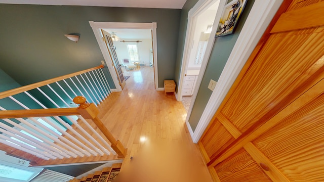 335 Western Ave, Hampden, ME 04444 - corridor featuring light wood-style floors, an upstairs landing, and baseboards